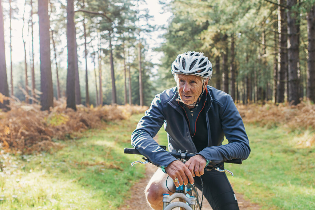Senior male on bike in forest